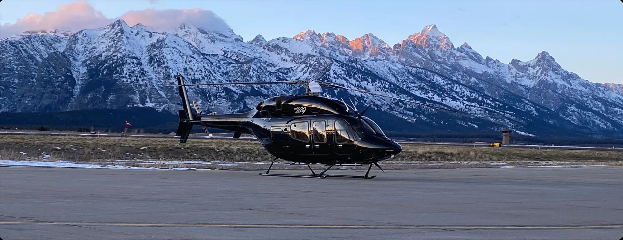 Bell 429 helicopter in a mountain setting